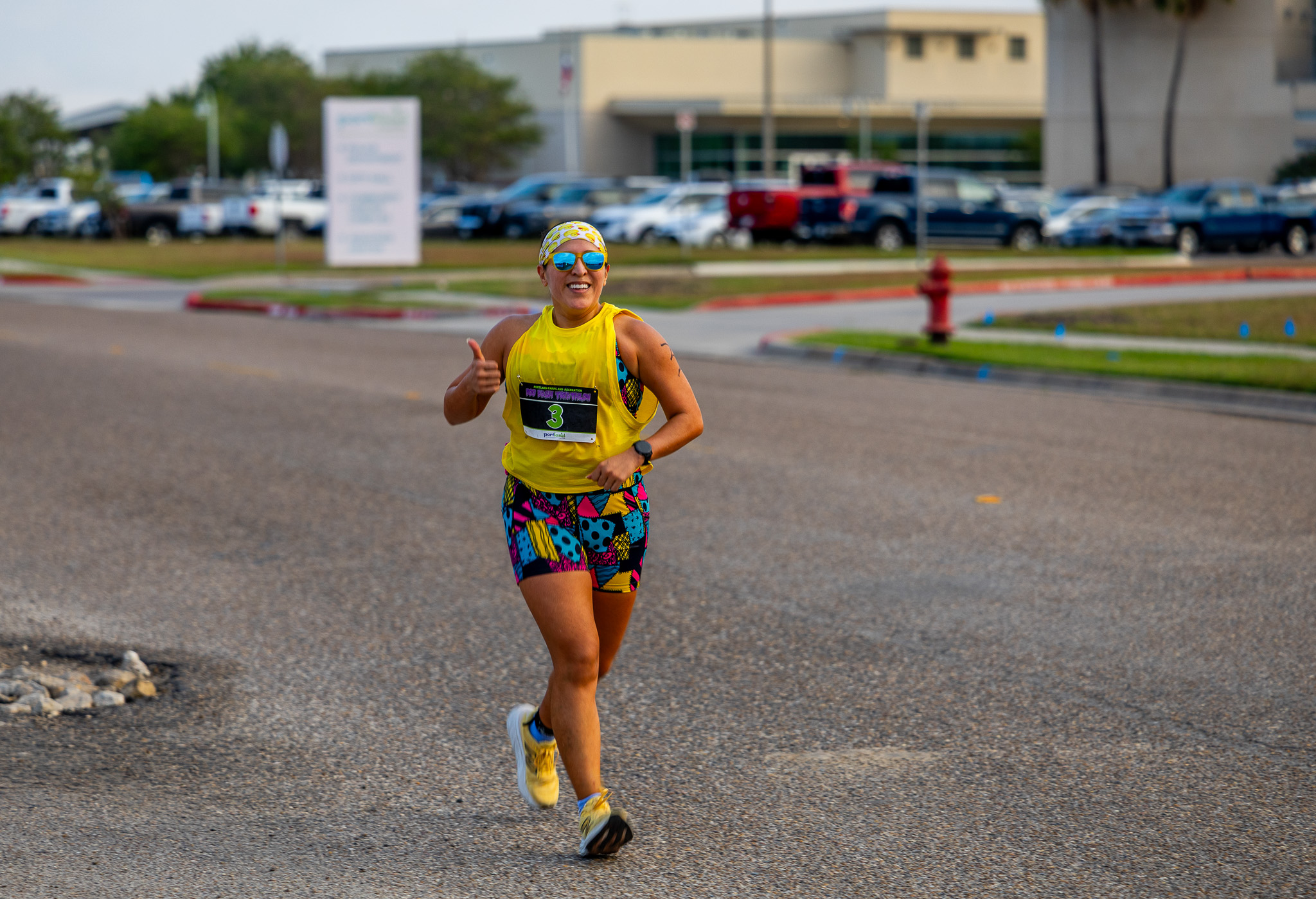 A runner in a colorful outfit on the run course