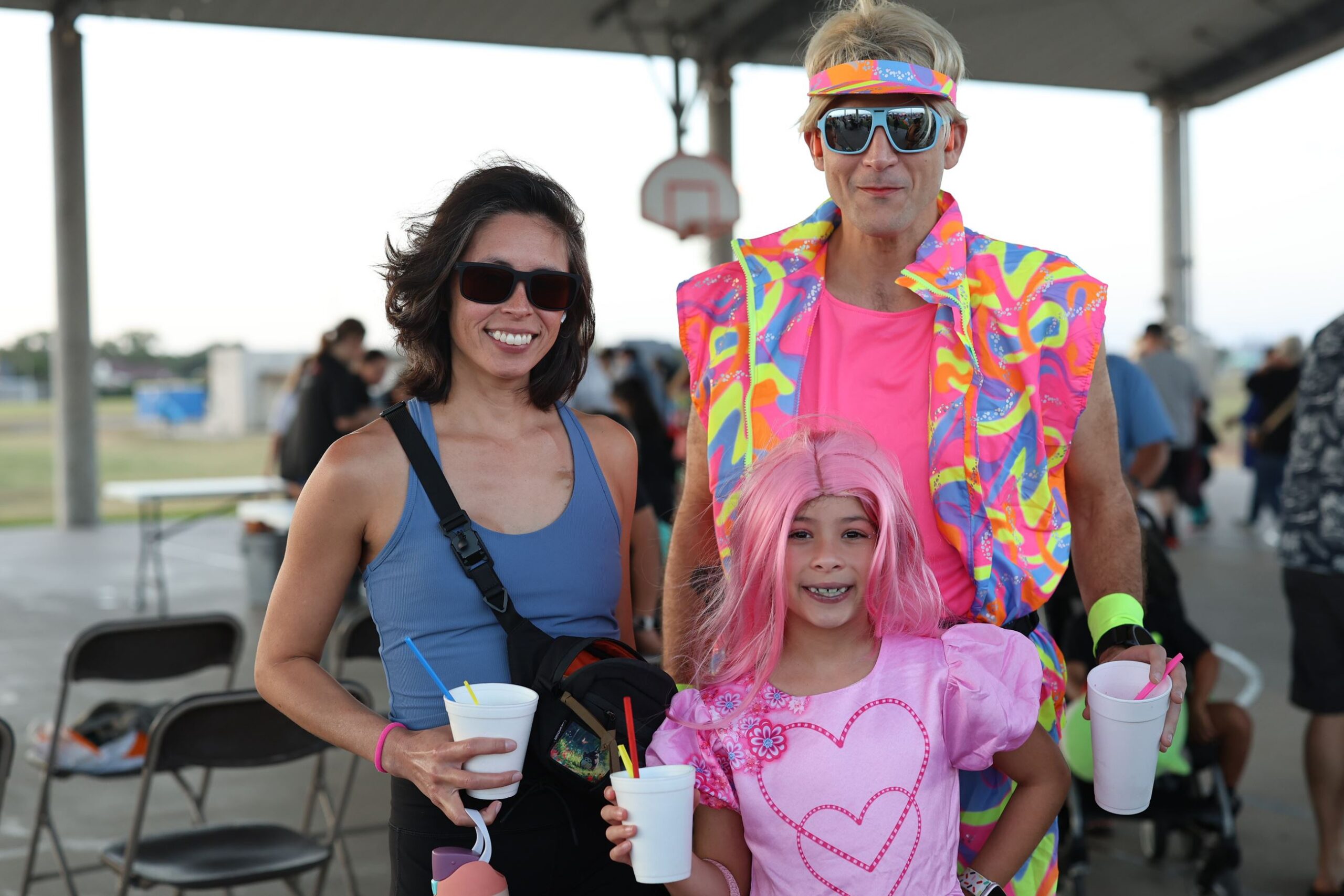 A family in bright costumes at the Boo Bash Festival